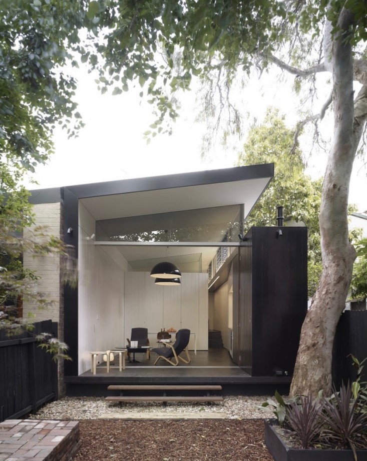 black-white-facade-patio-wood-stoop-outbuilding-fence-ChristopherPollyArchitect-gardenista