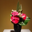 Red Amaryllis and green leaf Ikebana arrangement