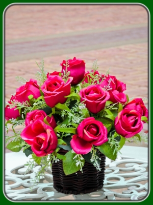 Bunch of Pink Roses in Wicker Vase