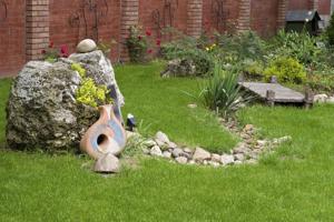 accentuate boulders-boulders and pebbles in a garden