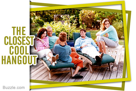 family sitting in the garden on chairs