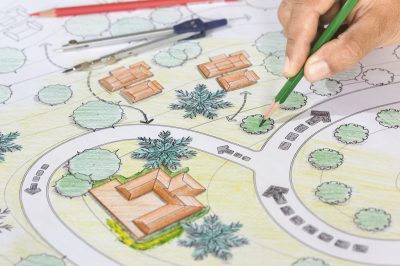 Landscape Architect Designs Blueprints For Resort.