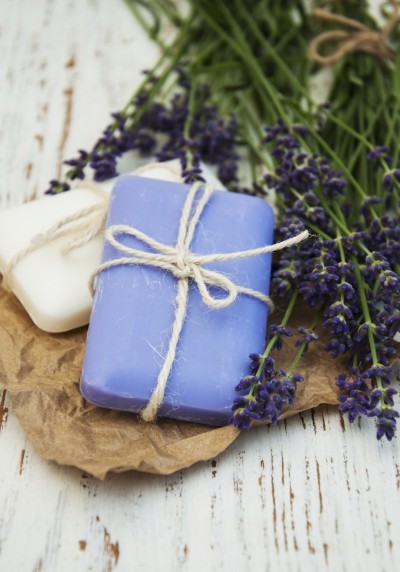Lavender with soap on a wooden background