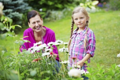 Girl and granny gardening together